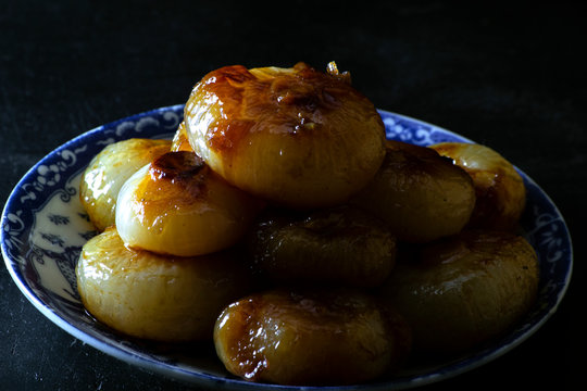 italian borettane onions with black backgound