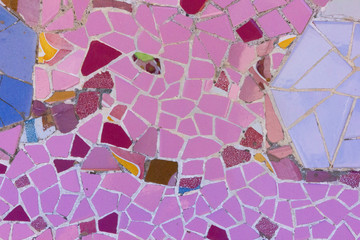 Pink ceramic tile background, broken glass texture, park Guell, Barcelona, Spain