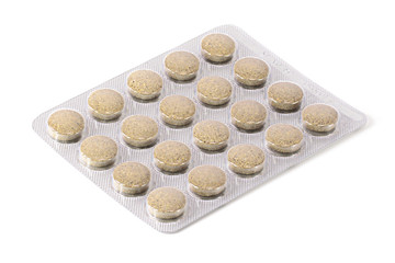 Brown pills blister Tablets on a white background