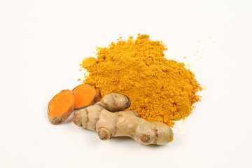Turmeric powder and turmeric root extract on a white background are used as a tonic for the body and food ingredients.