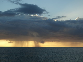 storm clouds at sunset over ocean