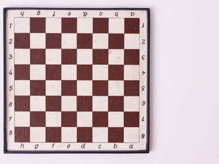 Top table game concept. Old wooden chess board isolated. top view with copy space.