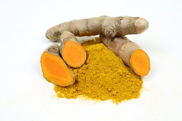 Turmeric powder and turmeric root extract on a white background, used as a tonic for body and food ingredients.