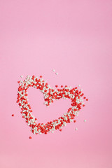 Colorful Valentines Day hearts  on pink background