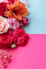 Flowers on pink and blue background. Valentines day background. Mothers day. 8 March