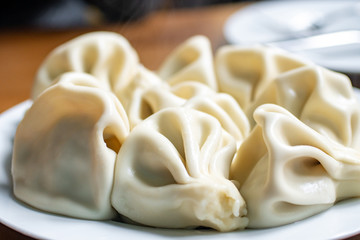 National Georgian cuisine. Khinkali with meat. Khinkali on a table.
