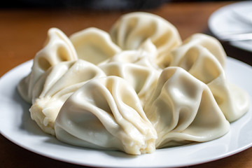 National Georgian cuisine. Khinkali with meat. Khinkali on a table.