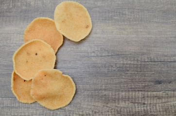 Pile of crunchy prawn crackers wooden