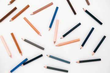 top view multicolored wooden pencils pattern on a white background