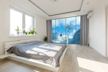 Comfortable big bed in interior of room