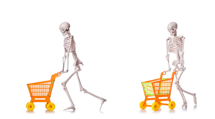 Skeleton with shopping cart trolley isolated on white