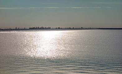 Nice water horizon of the mountain lake at sunset