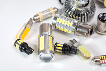 Light bulbs for car lamps. Automotive part in Silvery metallic and black color with wires and connecting elements