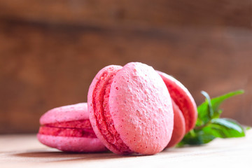 tasty sweet pink little macaroons on the table close