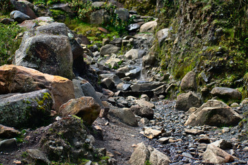 Naklejka na ściany i meble Landscape of a rocky creek path in Huascarán National Park