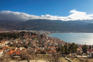 Fototapeta na wymiar A landscape of Old and New Town by the lake. View from the fort at the top of the hill. Ohrid, Northern Macedonia.