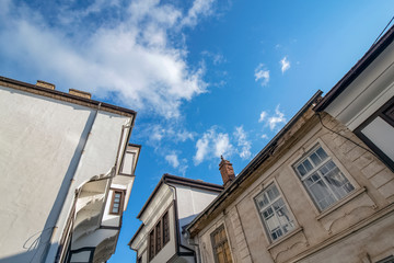 Obraz premium The architecture of the old town in Ohrid. Part of houses. Looking up. Northern Macedonia.