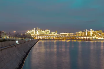 Foto op Plexiglas Glowing bridge over the river. The far plan. Moscow night © JoyNik