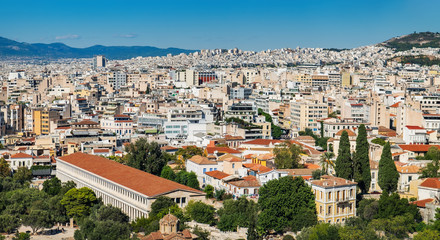 Fototapeta na wymiar Panorama of Athens as seen from Lycabettus hill, Attica, Greece. Summer scenic cityscape with traditional and modern Greek buildings under blue sky