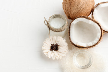 Set of coconut, oil, milk, dried flower with free copy space on white wooden background.  Spa treatment