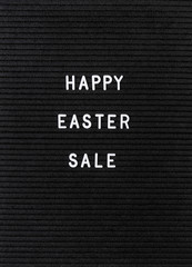 The words Happy Easter Sale on black felt letter board