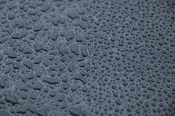 raindrops on a black background. Texture of drops on a dark background. Anti-rain for cars