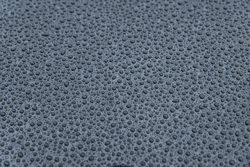 raindrops on a black background. Texture of drops on a dark background. Anti-rain for cars