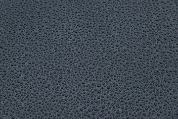 raindrops on a black background. Texture of drops on a dark background. Anti-rain for cars