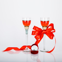 Two wine wineglasses and red box with engagement ring. Romantic concept. Wedding. St. Valentines day