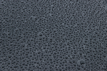 raindrops on a black background. Texture of drops on a dark background. Anti-rain for cars