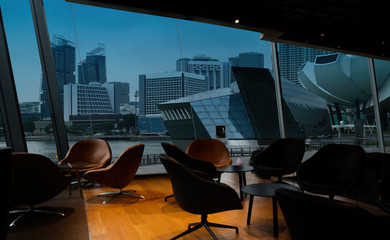 Singapore city view point from Lounge interior.overlooking a magnificent cityscape blue sky and city.