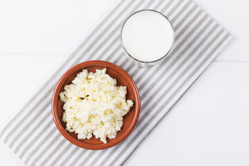 Homemade fermented beverage kefir with kefir grains in bowl on a white background, concept of natural fermented food and gut health