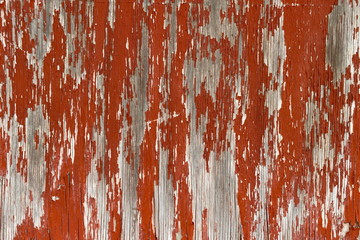 old red peeling painted wood wall