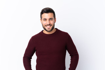 Young handsome man with beard over isolated white background laughing