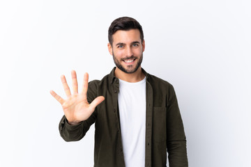 Young handsome man with beard over isolated white background counting five with fingers