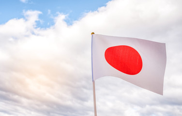  Flag of Japan and cloudy sky background