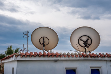 Television antenna on the roof of the building