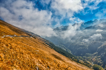 Clouds cover the hillside over the Grossglockner High Alpine Road in the Carinthian Alps in Austria
