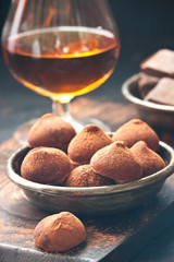  Composition with  chocolates truffles  and brandy glass