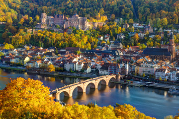 stone arch bridge over the river in autumn