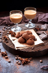  Sweet chocolate candy with liqueur in glass, dessert table