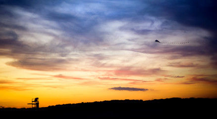 Lifeguard Tower and Flying Kite Silhouette