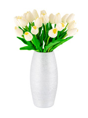 White plastic artificial tulips with green leaves in silver vase isolated on white background. Tulip flower decoration.