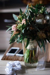 Beautiful modern bridal bouquet of colorful fresh flowers. Classic wedding traditional accessory.