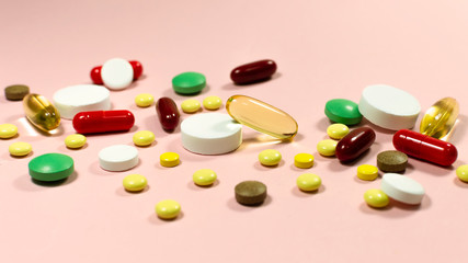 Pills and capsules for diet nutrition, anti-aging beauty supplements, probiotic drugs, pill vitamins as medicine and healthcare cosmetics, pink background