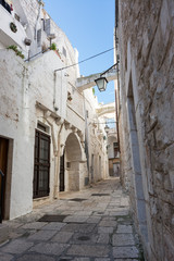 Fototapeta na wymiar Characteristic alley in the historic center of Cisternino (Italty)