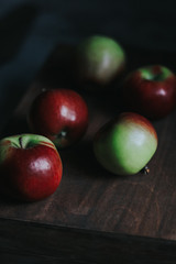 red-green apples on a wooden background