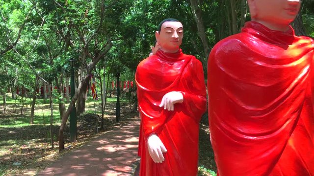 500 statues of Buddhist monks in Nellikulama Temple walking after Buddha, Sri Lanka, 4k footage video