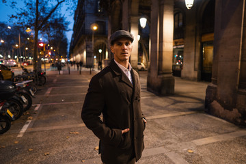 Old Fashion Man from the 1920s england walking along an old street of a historic city