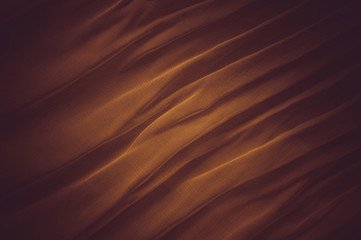 Obraz premium Red-orange waves abstract from silk fabric